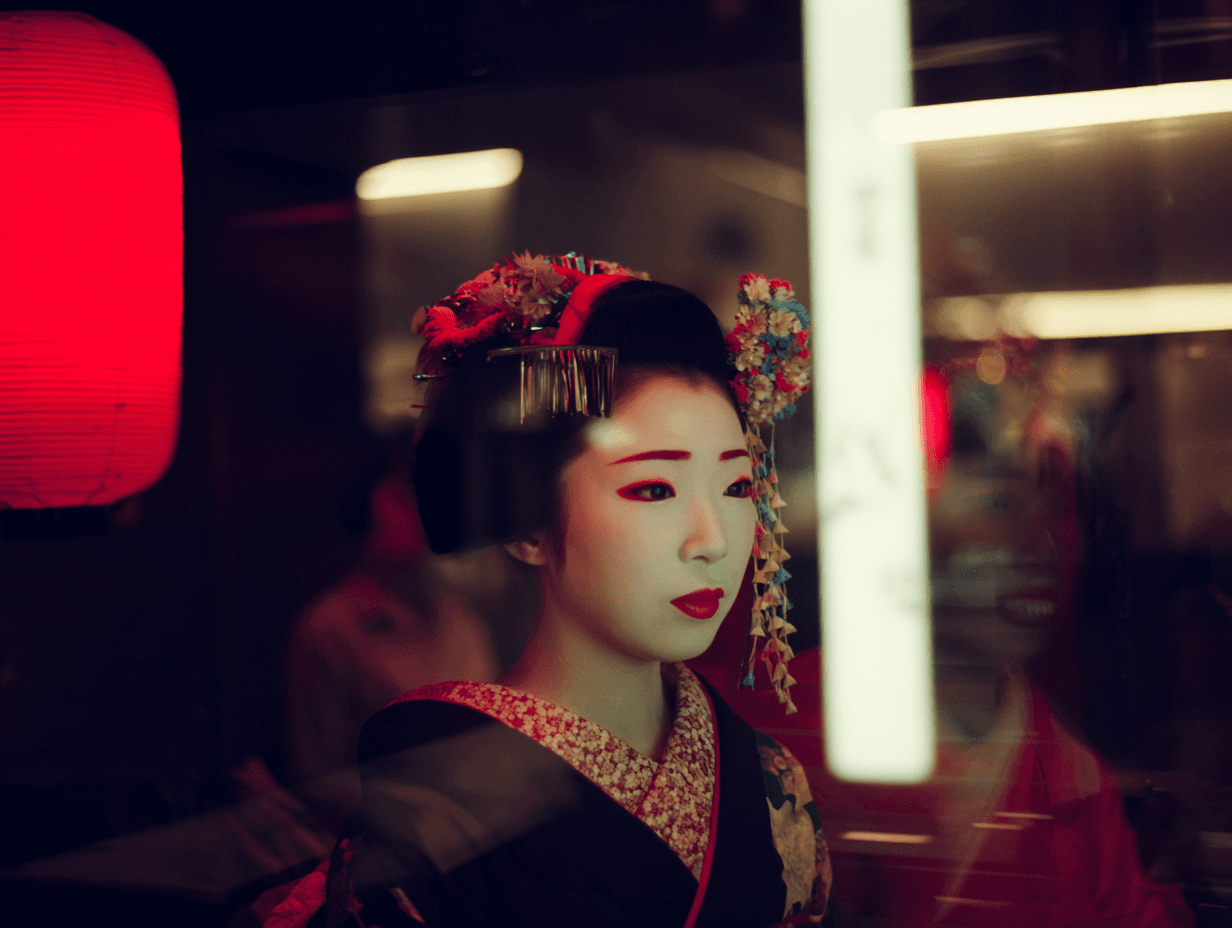Maiko in full kimono and ornamental hairpieces beside a glowing red paper lantern in a Kyoto alley